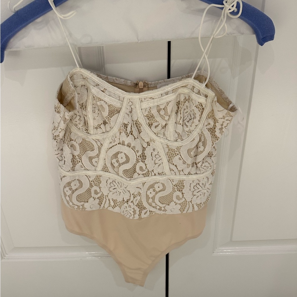 Super down white bodysuit.
